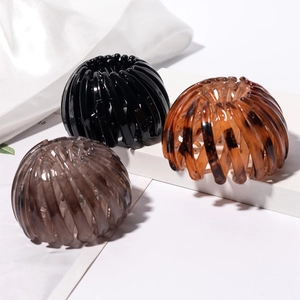 Nesting bird nest hair clips in black and amber colors for elegant buns and ponytails