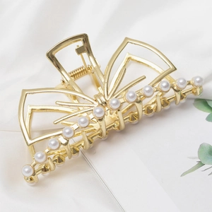 Pince à cheveux élégante en forme de nœud doré avec perles pour coiffure femme