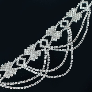 Detailed close-up of multi-layer rhinestone choker with geometric hollow structure