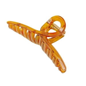 Large amber tortoiseshell hair claw clip for thick hair with glossy resin finish