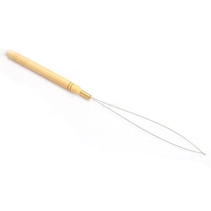 Detail showing the ergonomic wooden handle and fine steel wire loop of the hair extension tool