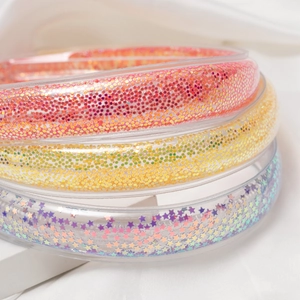 Trois serre-têtes rembourrés à paillettes avec des éléments colorés en résine étoilée