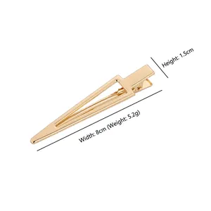 Pince à cheveux triangle doré en métal avec dimensions de 8cm de large et 1,5cm haut
