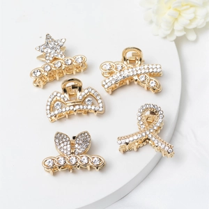 Lot de 5 mini pinces à cheveux dorées avec strass en formes d'étoiles et couronnes