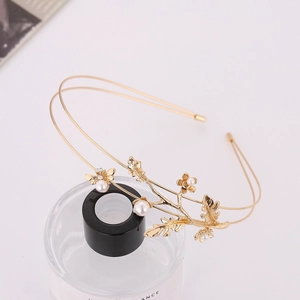 Elegant gold metal branch headband with white pearls and small bee floral details