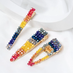 Lot de trois barrettes à cheveux en cristal multicolore et alliage doré sur satin