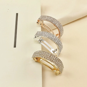 Lot de trois barrettes à strass élégantes en finitions or, argent et or rose