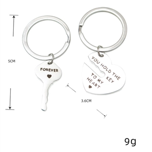 Polished stainless steel couple keychain set with engraved key and heart pendants