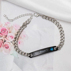 Detail of Her Beast couple bracelet with black metal plate and blue zircon on silk