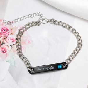 Close-up of black Her King stainless steel bar bracelet with blue gemstone inlay