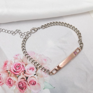 Detail of His Queen silver curb chain bracelet with rose gold plate and pink crystal