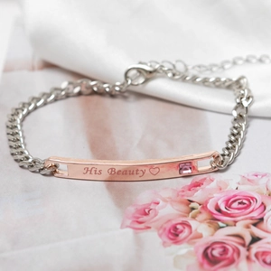 Close-up of His Beauty engraved stainless steel bracelet with a pink zircon stone