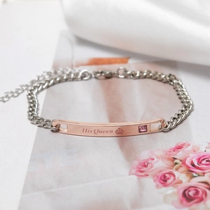 Detail of silver chain bracelet with His Queen engraved rose gold bar and pink zircon stone