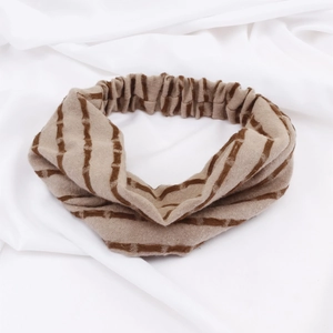 Retro striped knitted headband in brown with twist design and elastic fit for women