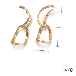 Golden S925 silver needle double hoop earrings featuring a 4cm long twisted metal design