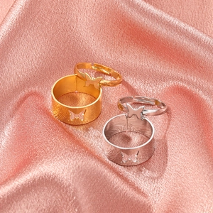 Elegant butterfly ring set for couples featuring gold and silver hollowed-out designs