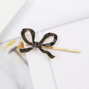Barrette élégante nœud noir et métal doré pour femme, accessoire de coiffure chic