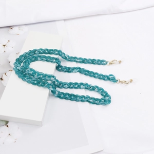 Detail view of teal acrylic mask chain with gold lobster clasps and silicone loops