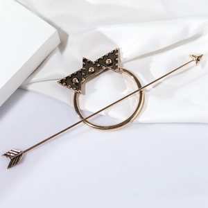 Vintage arrow hair pin with crown circular alloy design on white silk background