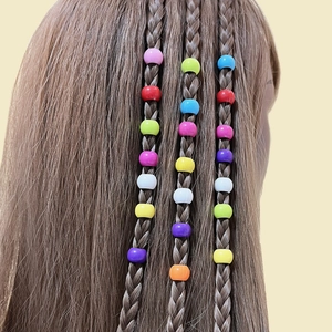 Colorful candy-colored plastic hair beads for braided hairstyles on a wig model