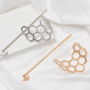 Irregular honeycomb hair pins in gold and silver with a delicate bee pendant