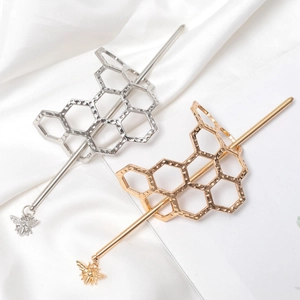 Golden and silver irregular honeycomb hairpins with bee pendants on white silk