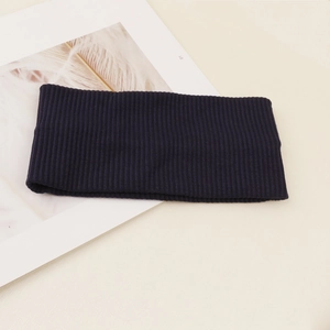 Detail shot of navy blue ribbed knit headband showing soft elastic texture and material
