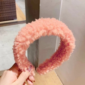 Pink lamb wool wide headband with soft plush texture for elegant winter styling