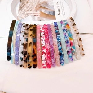 Acetate hair clips set with various marble patterns and tortoise shell finishes