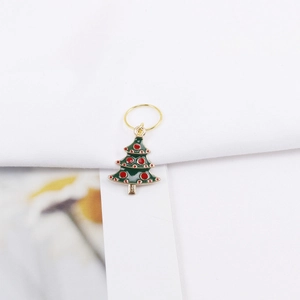 Detail of Christmas tree dreadlock charm with green enamel and gold alloy ring