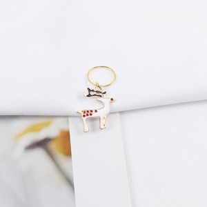 Detail of Christmas reindeer pendant with golden ring for DIY hair braiding accessories