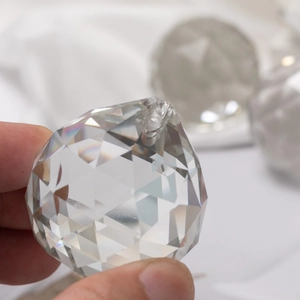 Clear 40mm multifaceted crystal ball pendant with precision geometric cuts for decor