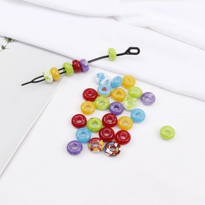 Colorful resin large hole beads for dreadlocks with jewelry tool on white background