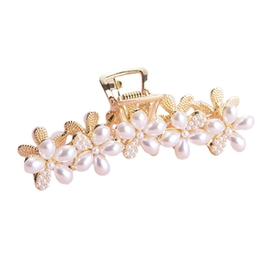 Elegant gold metal hair claw clip featuring five pearl flower designs on white background