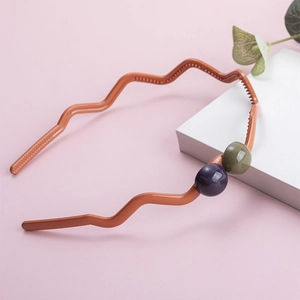 Minimalist matte orange wave headband for women with colorful bead accents