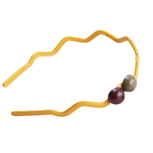 Simple yellow wave headband with decorative red and green glossy beads on white background