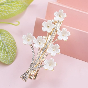 Elegant floral hair clip with faux pearls and champagne gold metal base for women