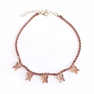 Bracelet de cheville papillon or rose avec strass violets et breloques papillons