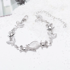 Detail of silver leaf bracelet with white cat eye stone and sparkling crystals