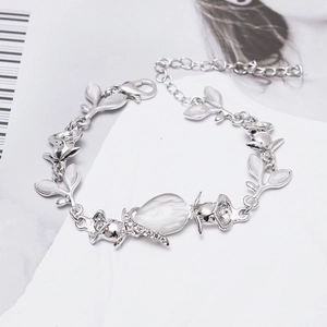 Leaf-shaped silver bracelet with teardrop opal stone and sparkling zircon details