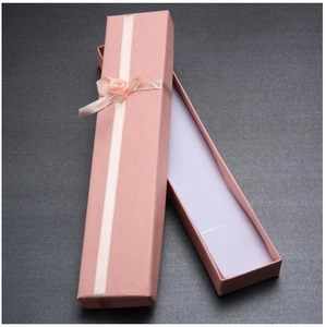 Pink rectangular jewelry gift box with cream ribbon and fabric rose flower detail