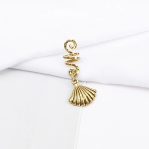 Detail view of golden spiral hair ring with shell charm for braided hairstyles