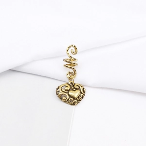 Detailed macro view of retro bronze hollow heart pendant with spiral alloy hair coil loop