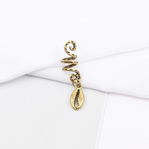 Macro detail of retro golden spiral hair coil with shell pendant for dreadlock styling