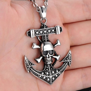 Men's silver anchor necklace with pirate skull and crossbones pendant on hand