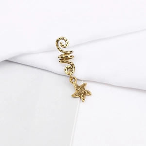 Detailed view of a gold spiral dreadlock bead with a textured starfish pendant accessory
