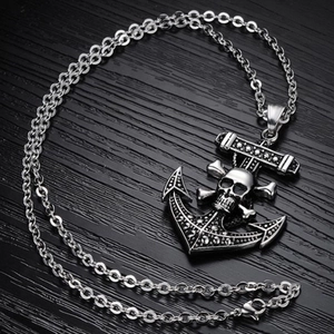 Detailed close-up of a punk pirate anchor necklace with a silver skull and crossbones design