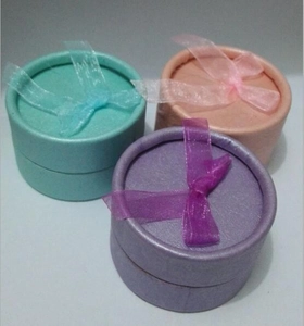 Three-piece round jewelry gift box set with organza bows in pastel mint, pink, and lavender