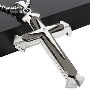 Macro shot of triple-layer cross pendant with sparkling zircon and bead chain