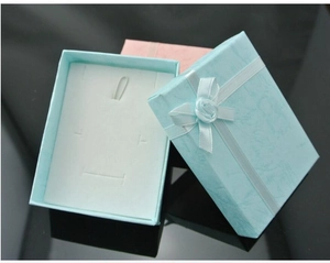 Detailed view of jewelry gift boxes with satin ribbon roses and multi-functional inserts